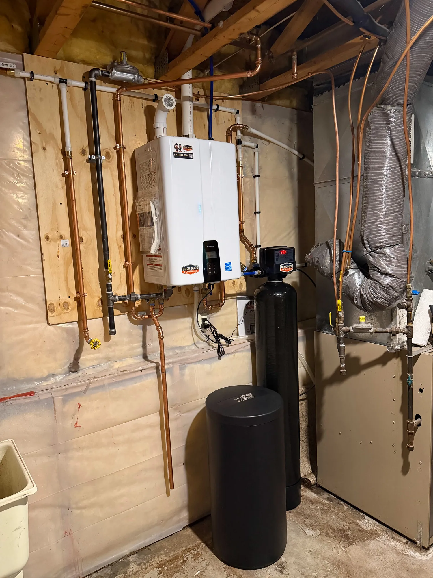 Tankless water heater and water softener installed by Duck Duck Plumbing