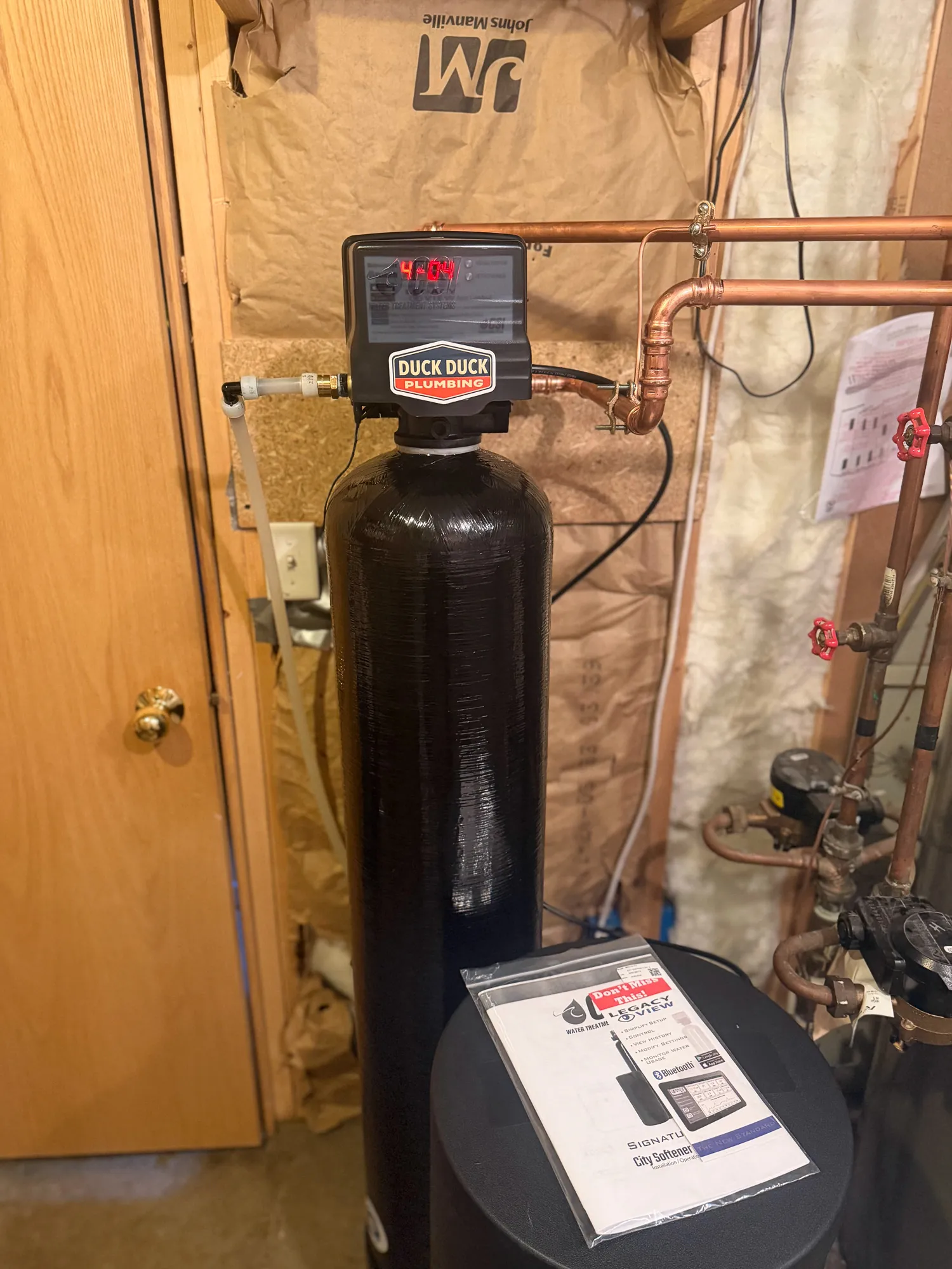 Water softener installed in a basement