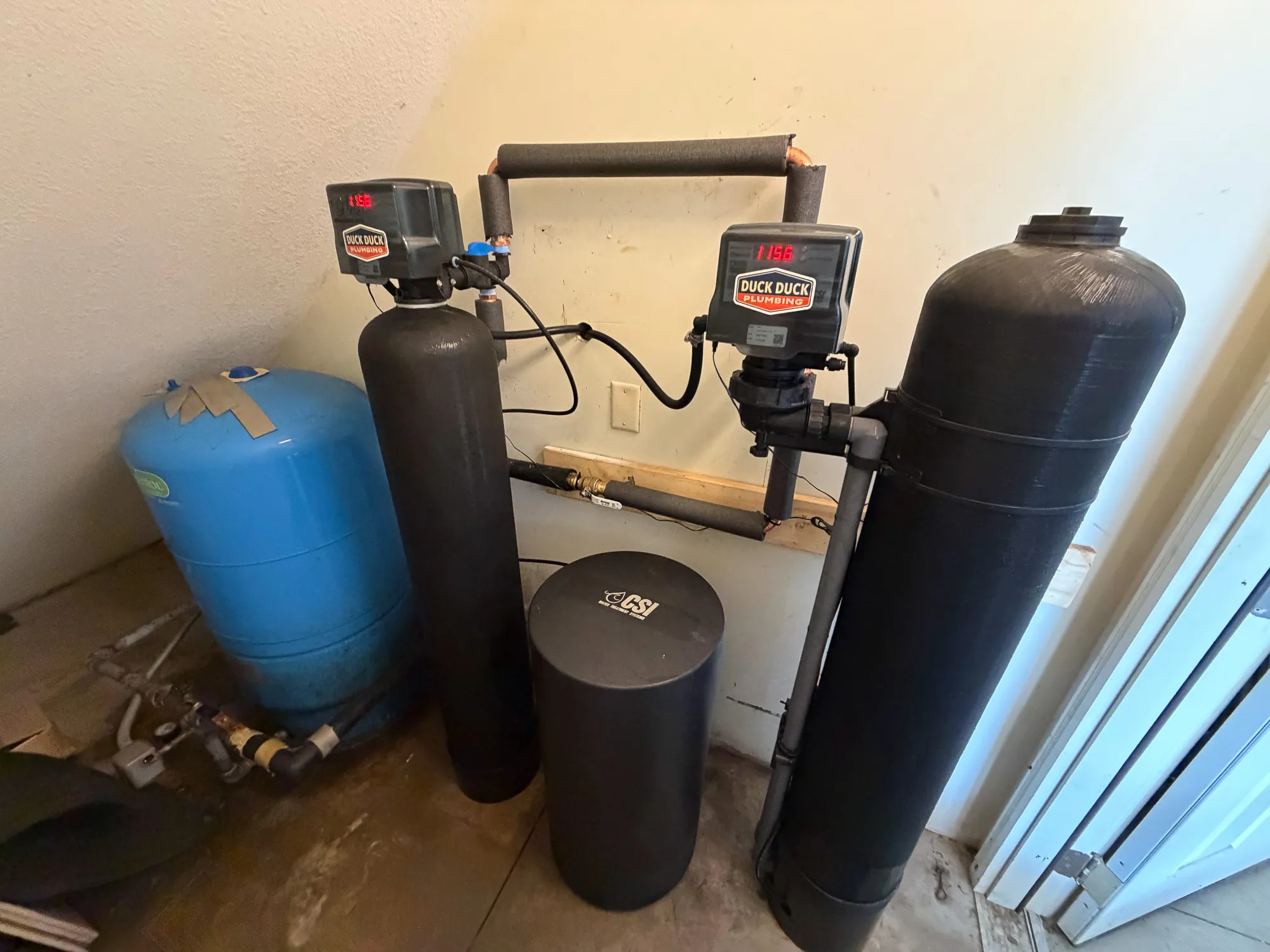 Well water treatment system with softener and filter